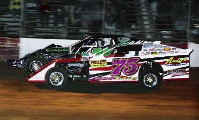 Terry Phillips (75) races with Brad McEwan at the start of the main event last May at Lebanon I-44 Spedway.